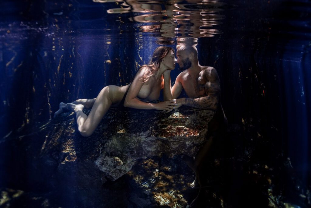 a couple celebrating their anniversary underwater
